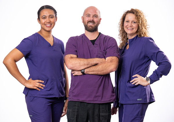 Three nurses in scrubs